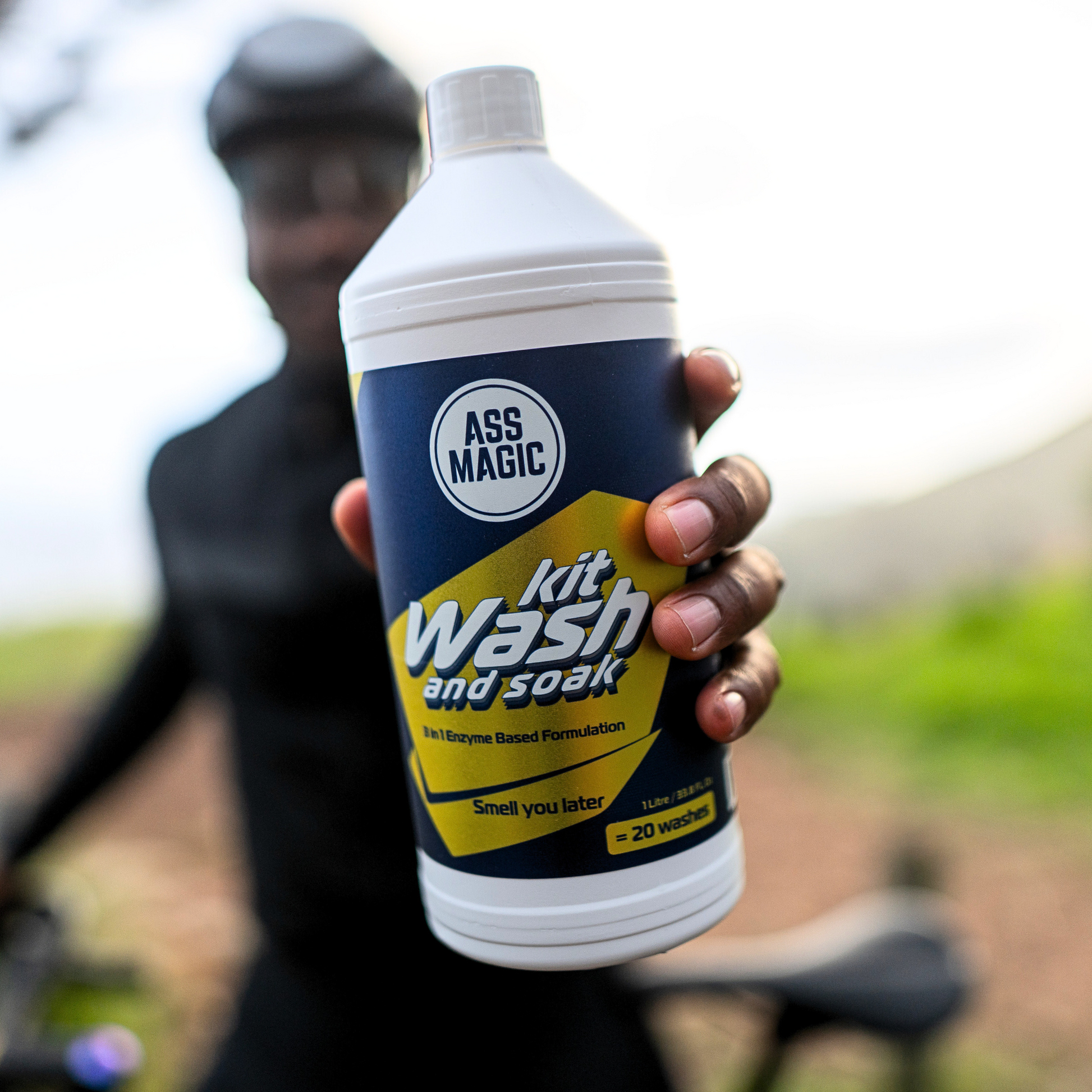 Close-up of athlete holding ASS MAGIC 1L Kit Wash and Soak – a powerful sports kit fabric cleanser with odour control.